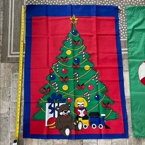 Festive Christmas Tree flag. Motif of Toys under decorated Christmas tree.
